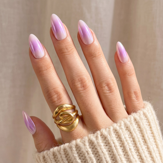 Glossy lilac marble press-on nails with sheer white swirl, almond shape