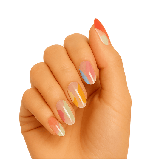 Hand showing translucent gel nail wraps in pastel rainbow gradient colours for at-home manicure