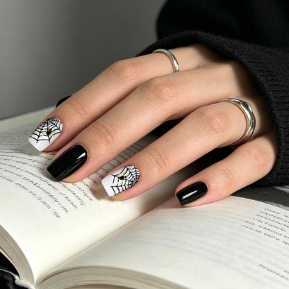 Glossy black and white semi-cured gel wraps with spiderweb and spider Halloween design