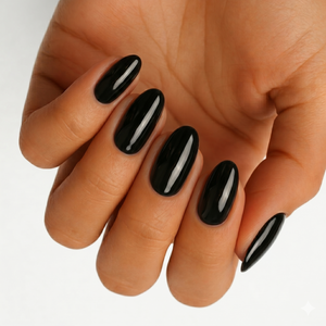 Glossy black semi-cured gel nail wraps on almond-shaped nails, solid classic finish