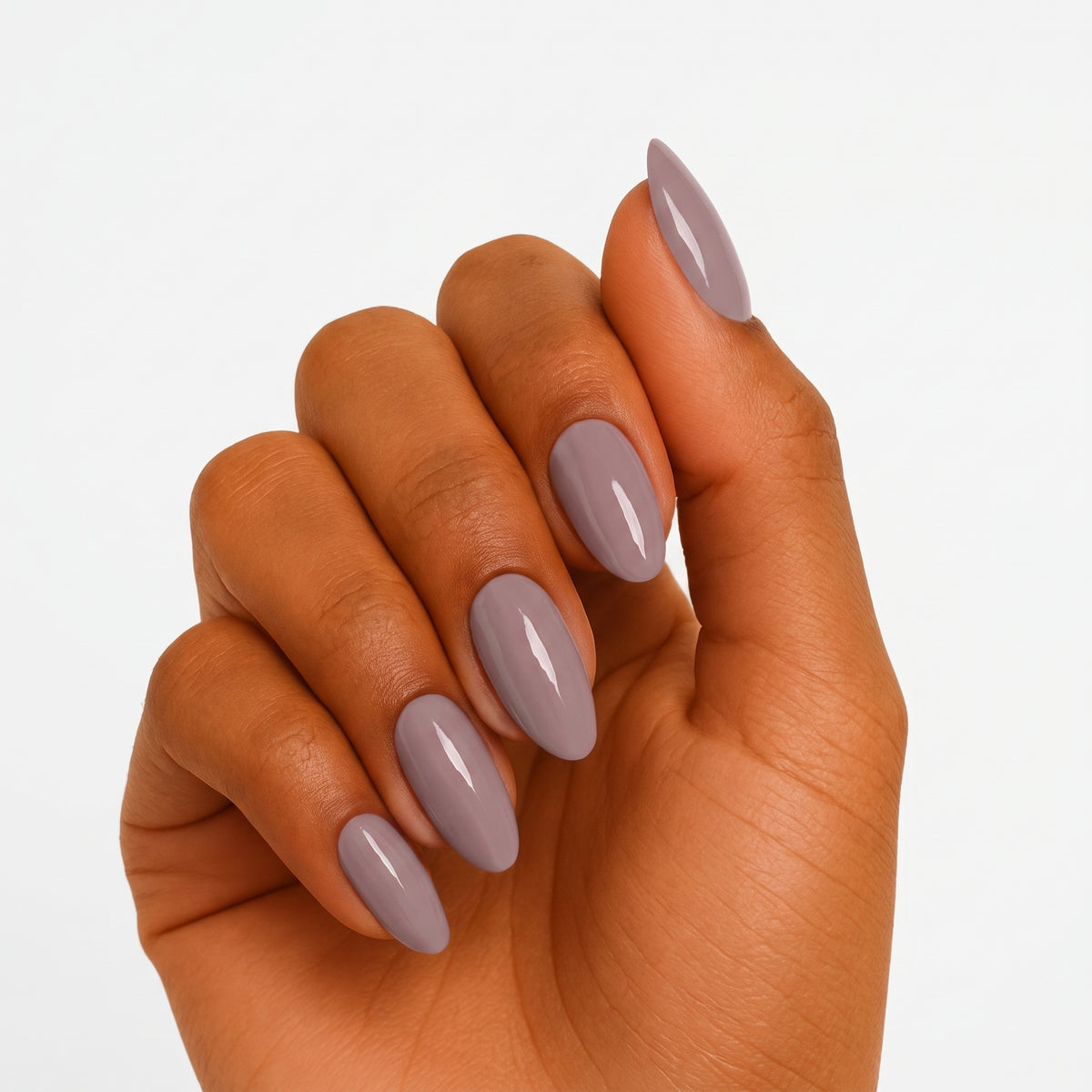 Taupe-grey glossy semi-cured gel nail wraps on almond-shaped nails
