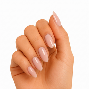 Nude pink glossy semi-cured gel nail wraps on almond-shaped nails