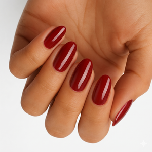 Glossy dark red semi-cured gel nail wraps on almond-shaped nails.