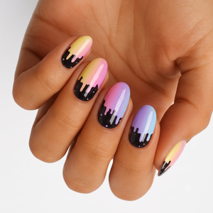 Pastel rainbow gradient nail wraps with glossy black dripping paint and star design