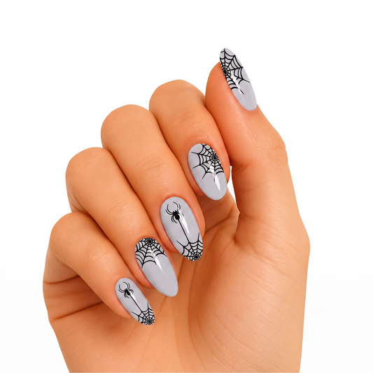 Glossy grey semi-cured gel nail wraps with black spiderweb and spider Halloween design