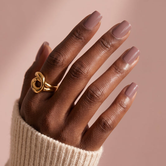 Mauve-pink glossy semi-cured gel nail wraps in a solid, glossy finish on short square nails.