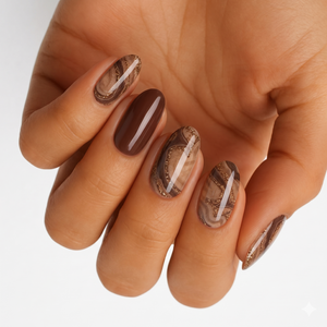 Glossy nail wraps with brown marble swirl design, gold glitter lines, solid chocolate accent nail.