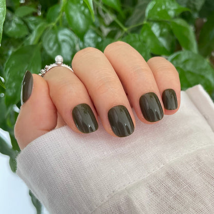 Short, square-cut olive green soft gel press-on nails with a glossy, solid finish.
