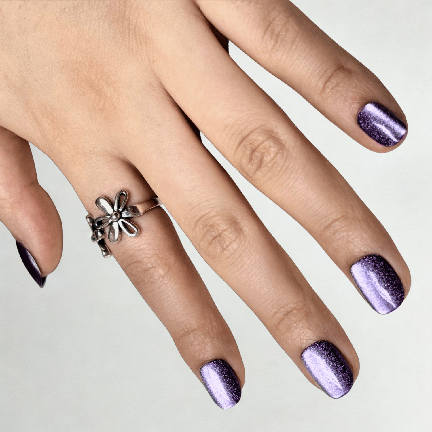 Purple metallic chrome semi-cured gel nail wraps on short round nails