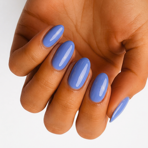 Powder blue glossy nail wraps in a solid colour on almond-shaped nails