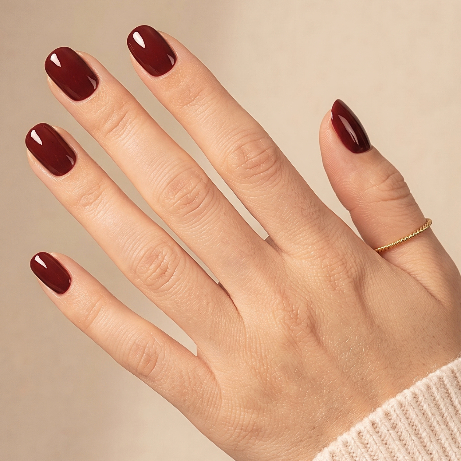 Deep dark red glossy semi-cured gel nail wraps on short round nails