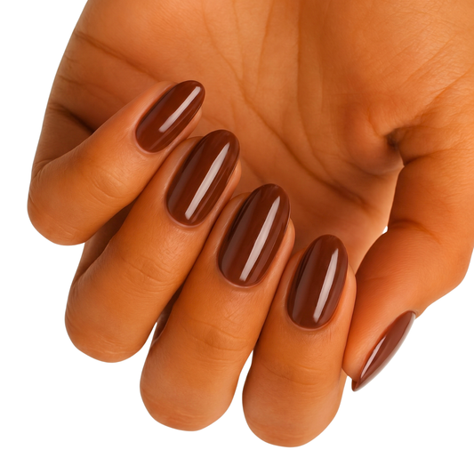Hand displaying glossy chocolate brown gel nail wraps in warm nude tone for at-home manicure