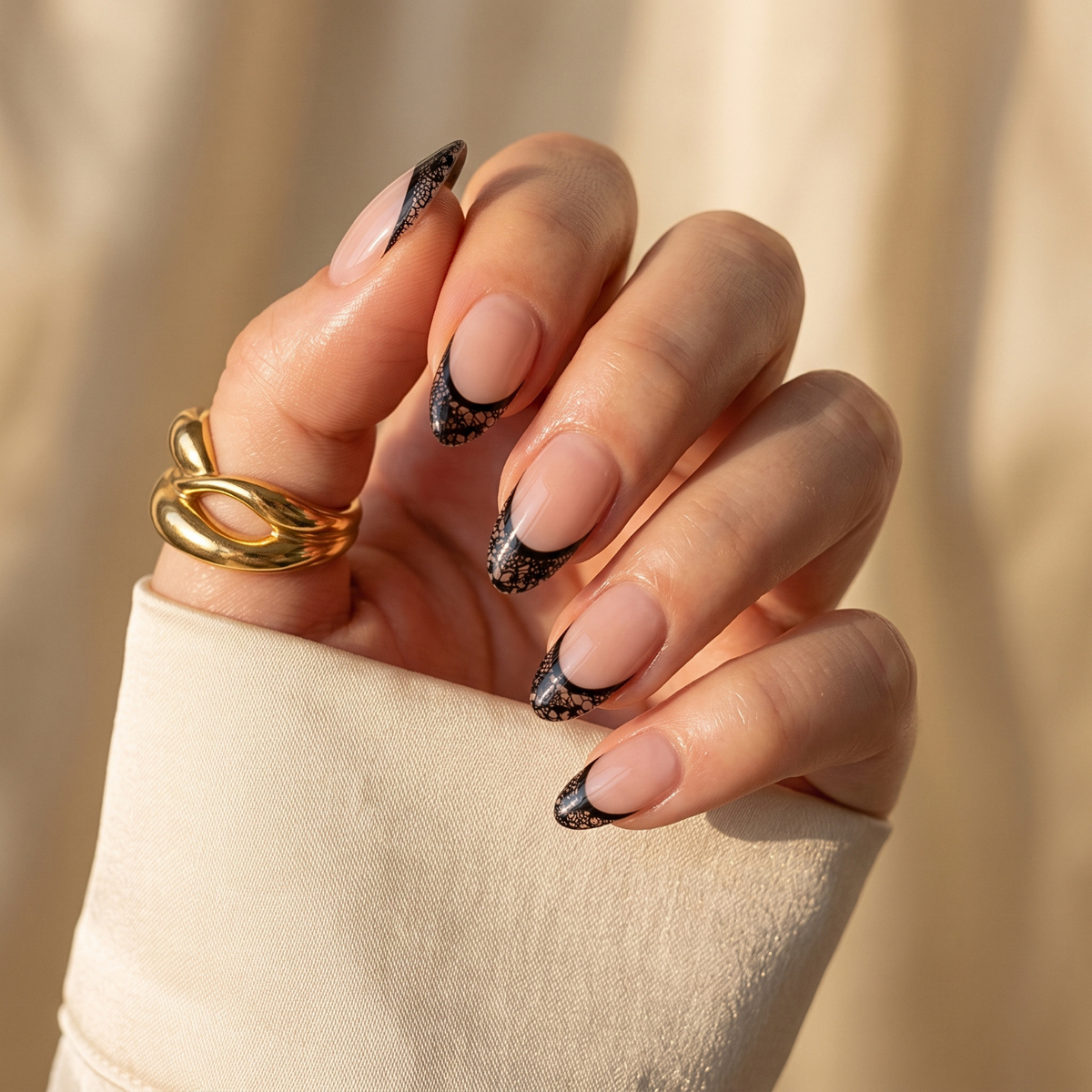Short almond soft gel press-on nails, nude base with black lace French tips