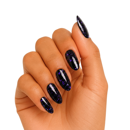 Black semi-cured gel nail wraps with purple foil flakes, glossy almond shape.