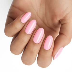 Glossy pale pink nail wraps in a solid colour on almond-shaped nails