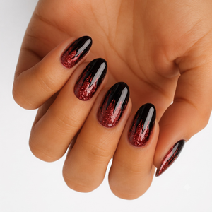 Glossy black nail wraps with red glitter flame ombre tips on almond-shaped nails