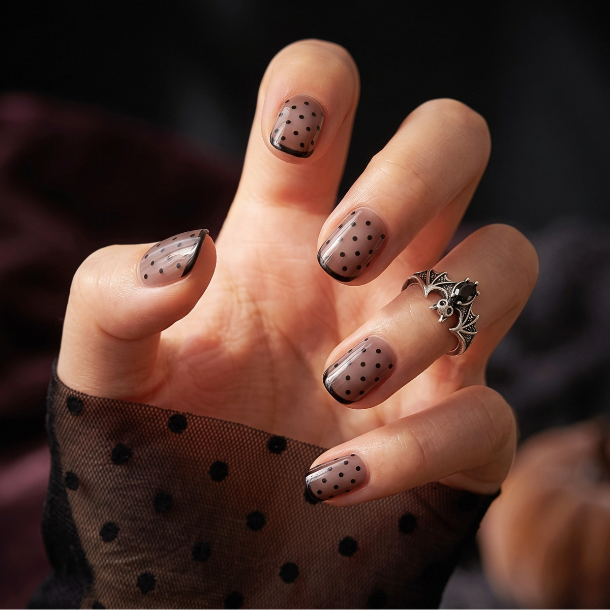 Extra short press-ons, sheer nude with black polka dots and glossy tip outline