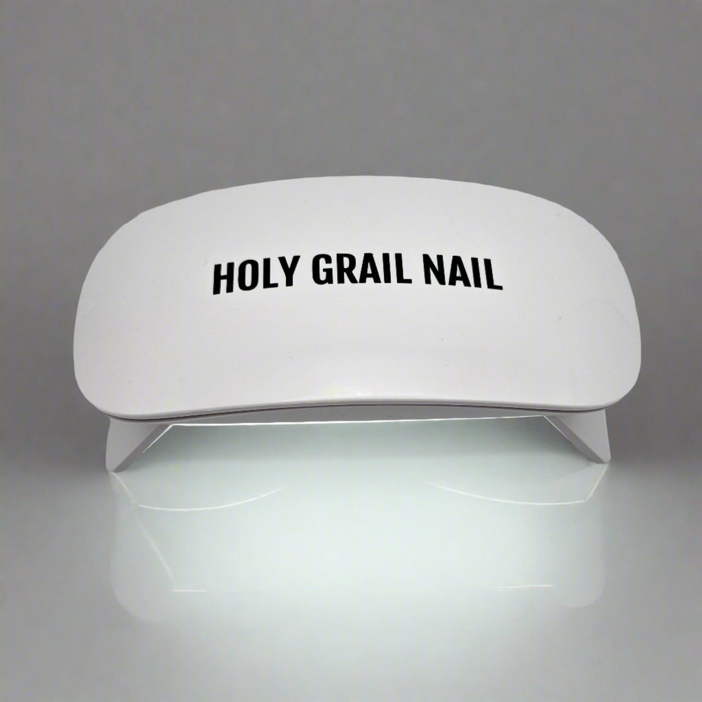 White UV LED nail lamp for curing gel nails at home manicure