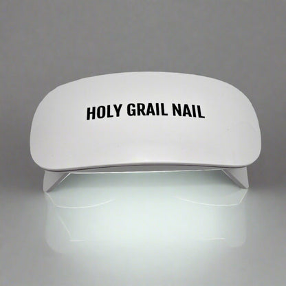 White UV LED nail lamp for curing gel nails at home manicure
