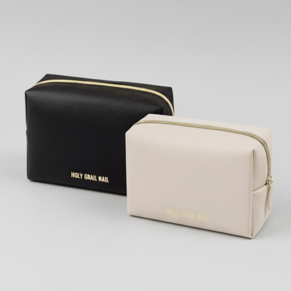 Black and beige makeup bags with gold zips for nail storage