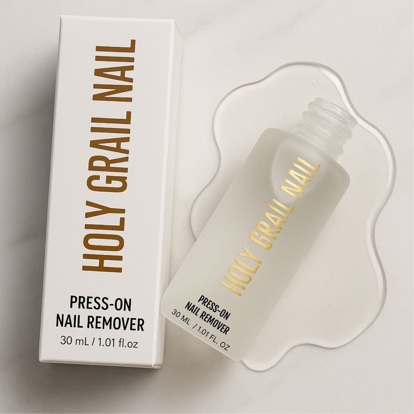 Press-on nail remover solution bottle with white packaging for gentle nail removal