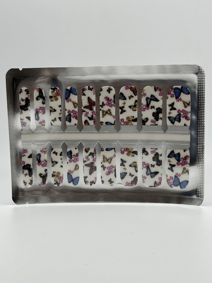 Kids nail wraps sheet featuring multicoloured butterfly designs in foil packaging