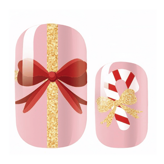 Kids Christmas nail wraps with pink ribbon bow and candy cane glitter designs