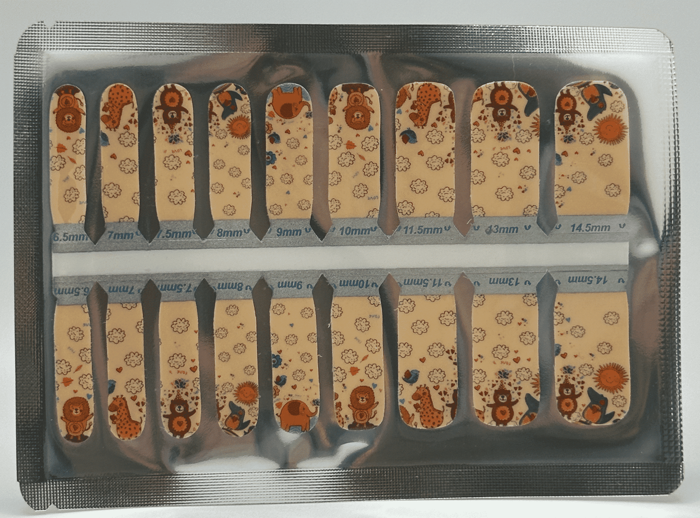 Safari themed children's nail wraps sheet with cute animal patterns and size markings