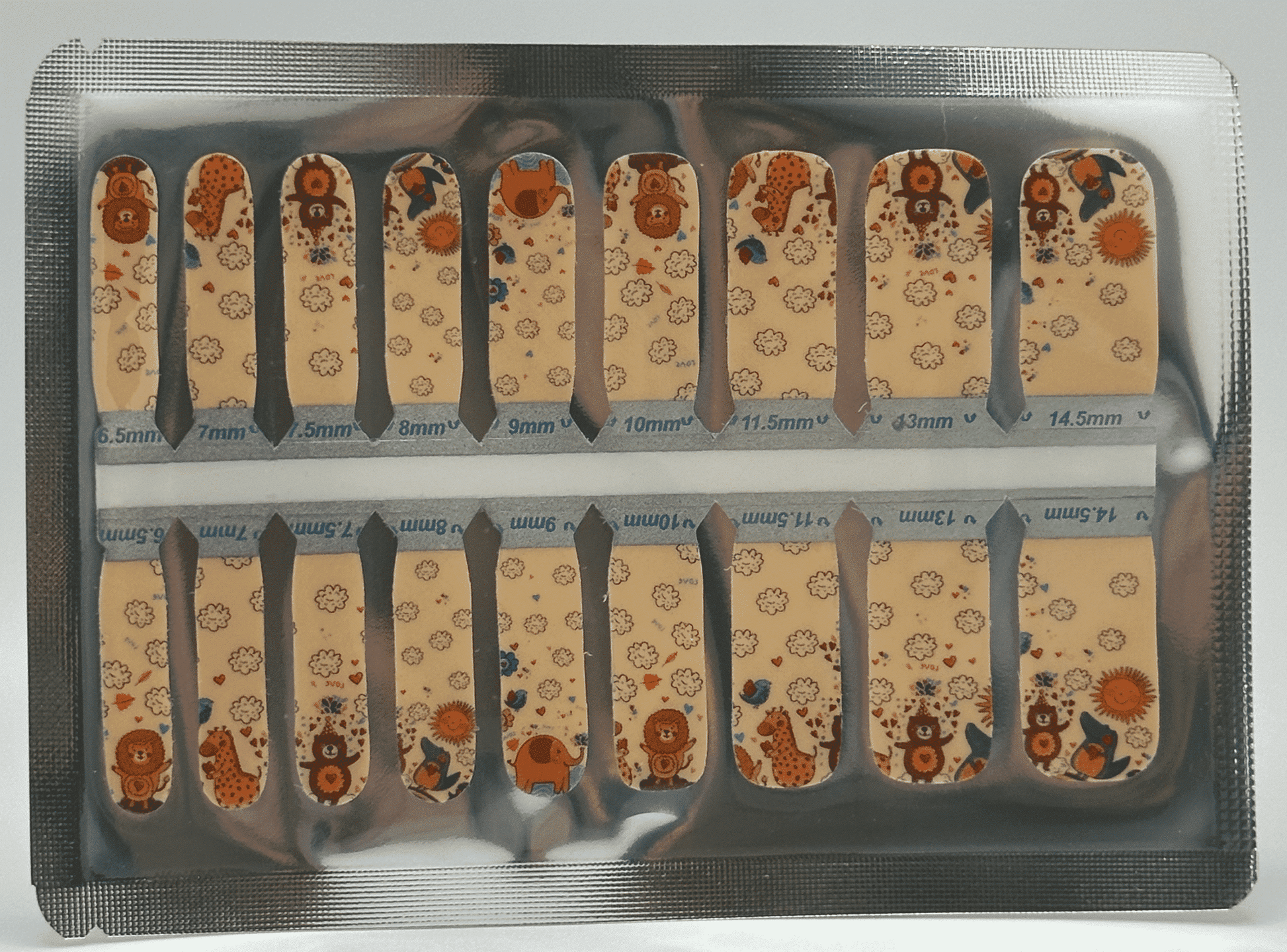 Safari themed children's nail wraps sheet with cute animal patterns and size markings