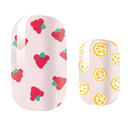 Tutti frutti kids nail wraps with strawberry and lemon patterns on pink base