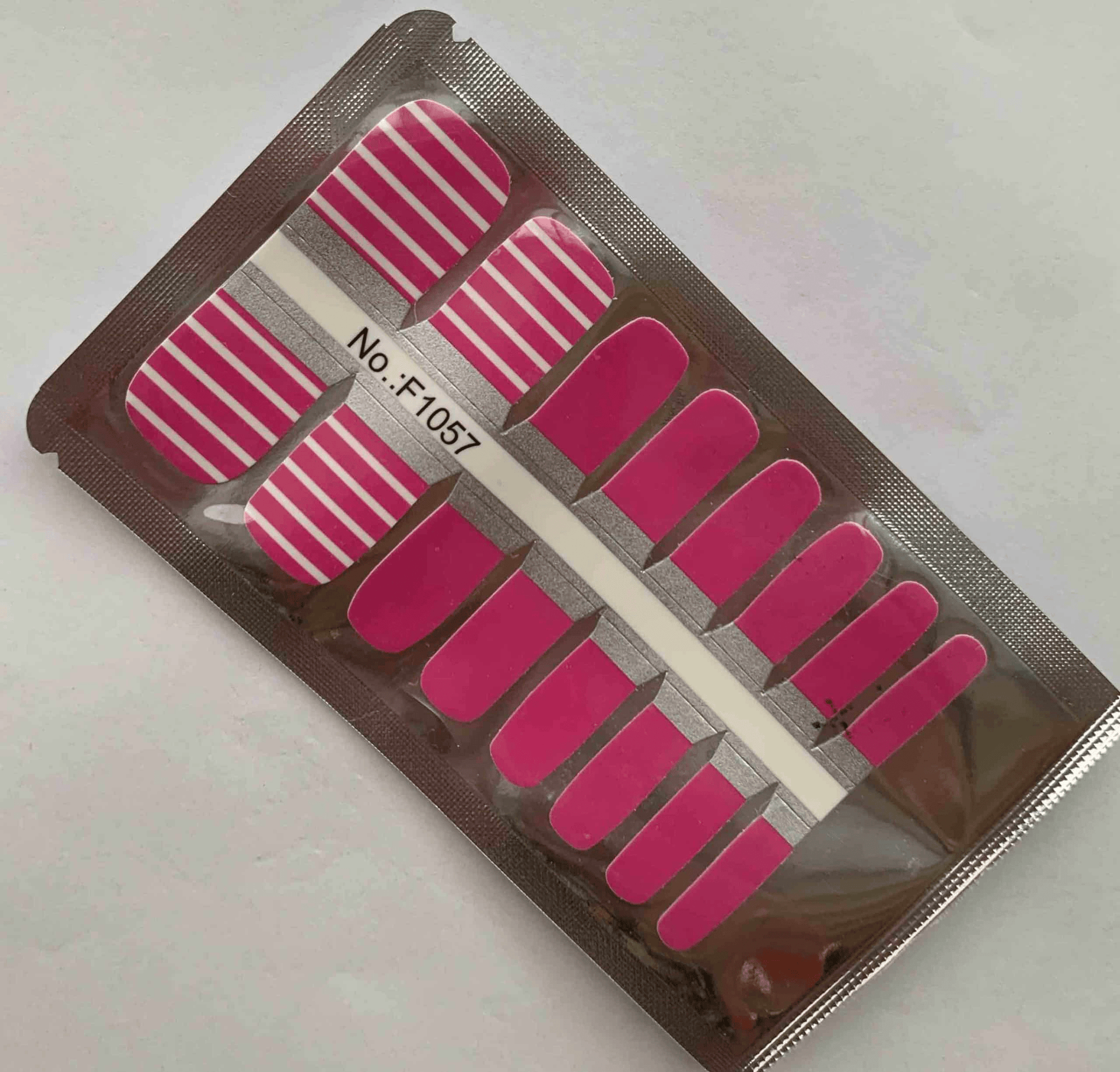 Pink striped pedicure nail wraps packaging showing toe nail wrap designs