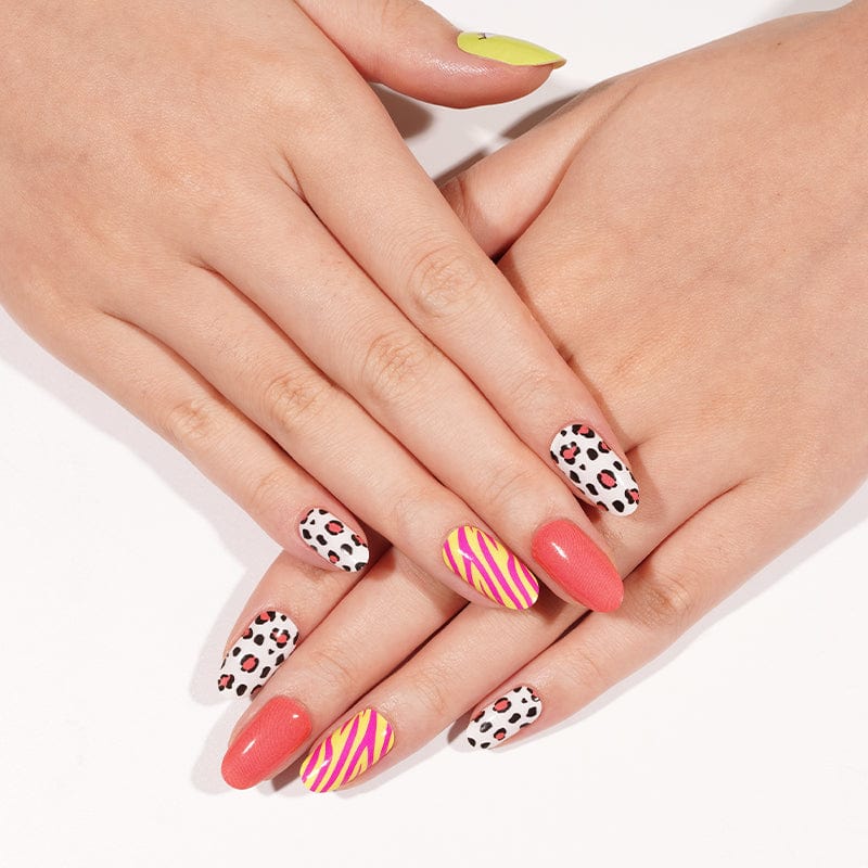Mixed nail art featuring leopard print nail wraps with striped and coral designs