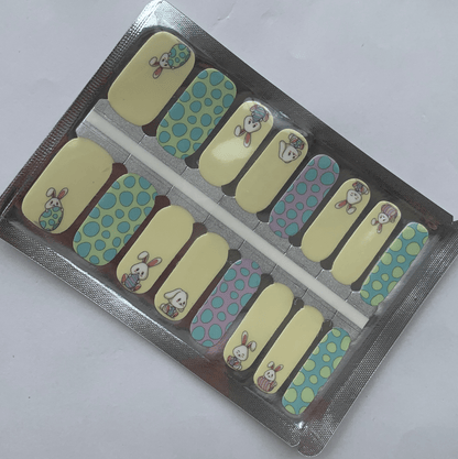 Non-UV nail wraps packaging showing blue and yellow bunny design manicure wraps in foil packet