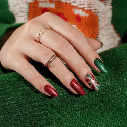 Christmas themed nail art with sparkly red green wraps and festive peppermint designs