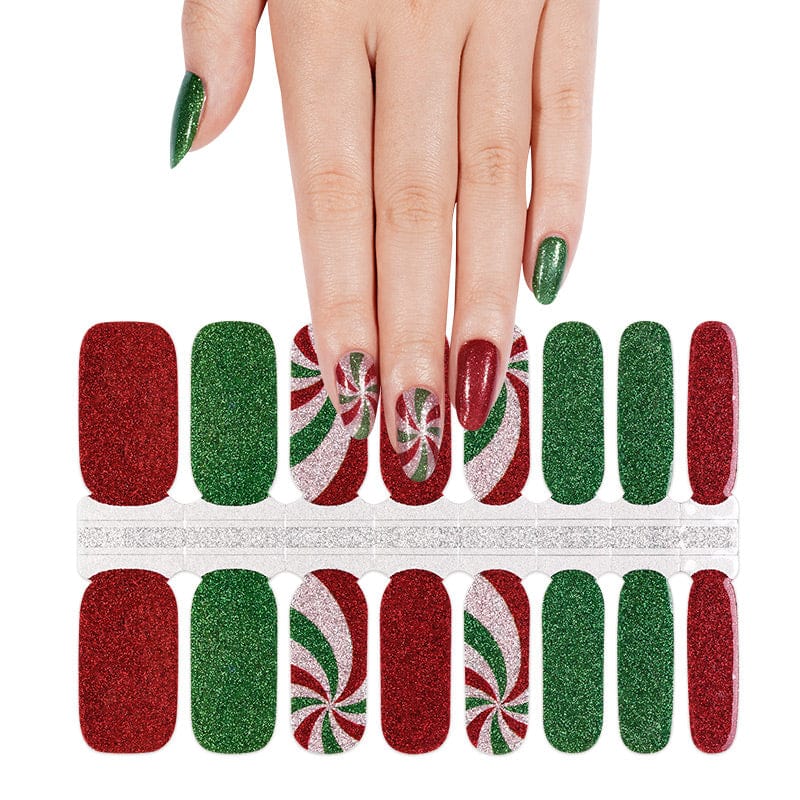 Festive Christmas nail wrap sheet with red green glitter and peppermint swirl patterns