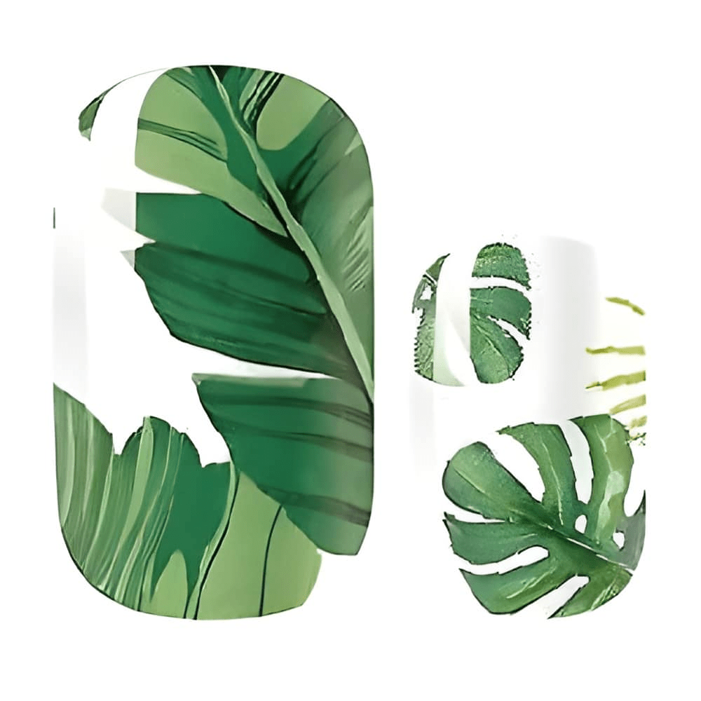 Close-up tropical palm leaf nail wraps showing green monstera botanical nail art design