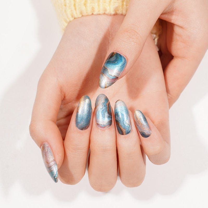 Turquoise marble gel nail wraps with metallic finish displayed on open palm