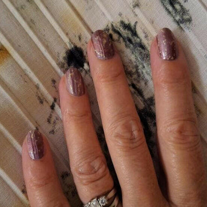 Brown marble glitter nail wraps on hand showing stone pattern finish