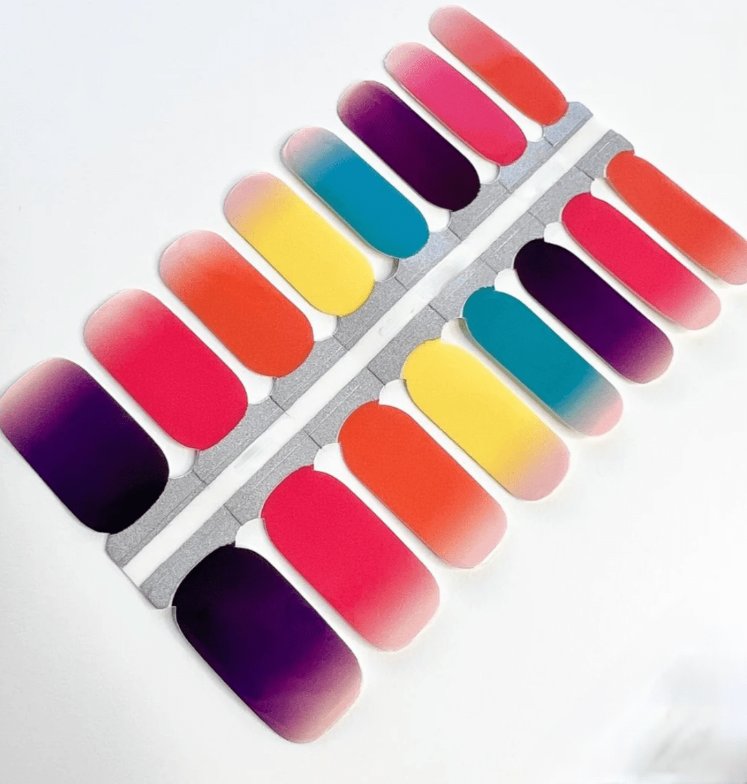 Rainbow ombre nail wraps sheet showing vibrant gradient colours from pink to purple