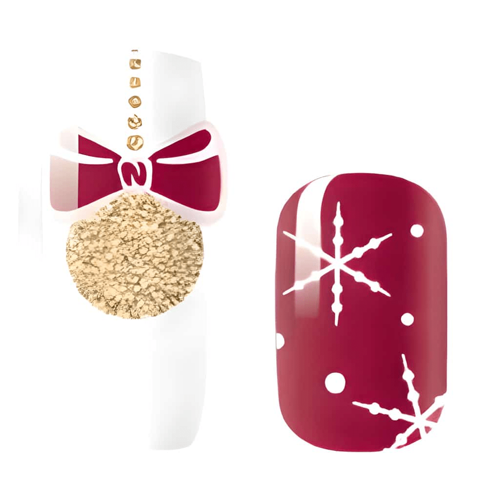 Red Christmas nail wraps with white snowflake pattern and gold glitter accent