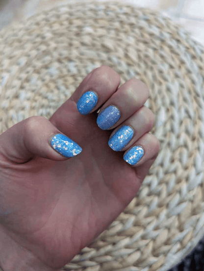 Blue glitter ombre nail wraps with sparkle finish on hand manicure