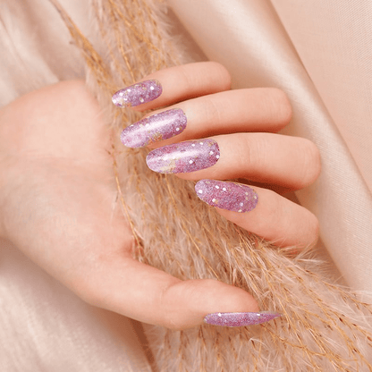 Pink purple glitter gradient gel nail wraps on hand showing sparkly finish