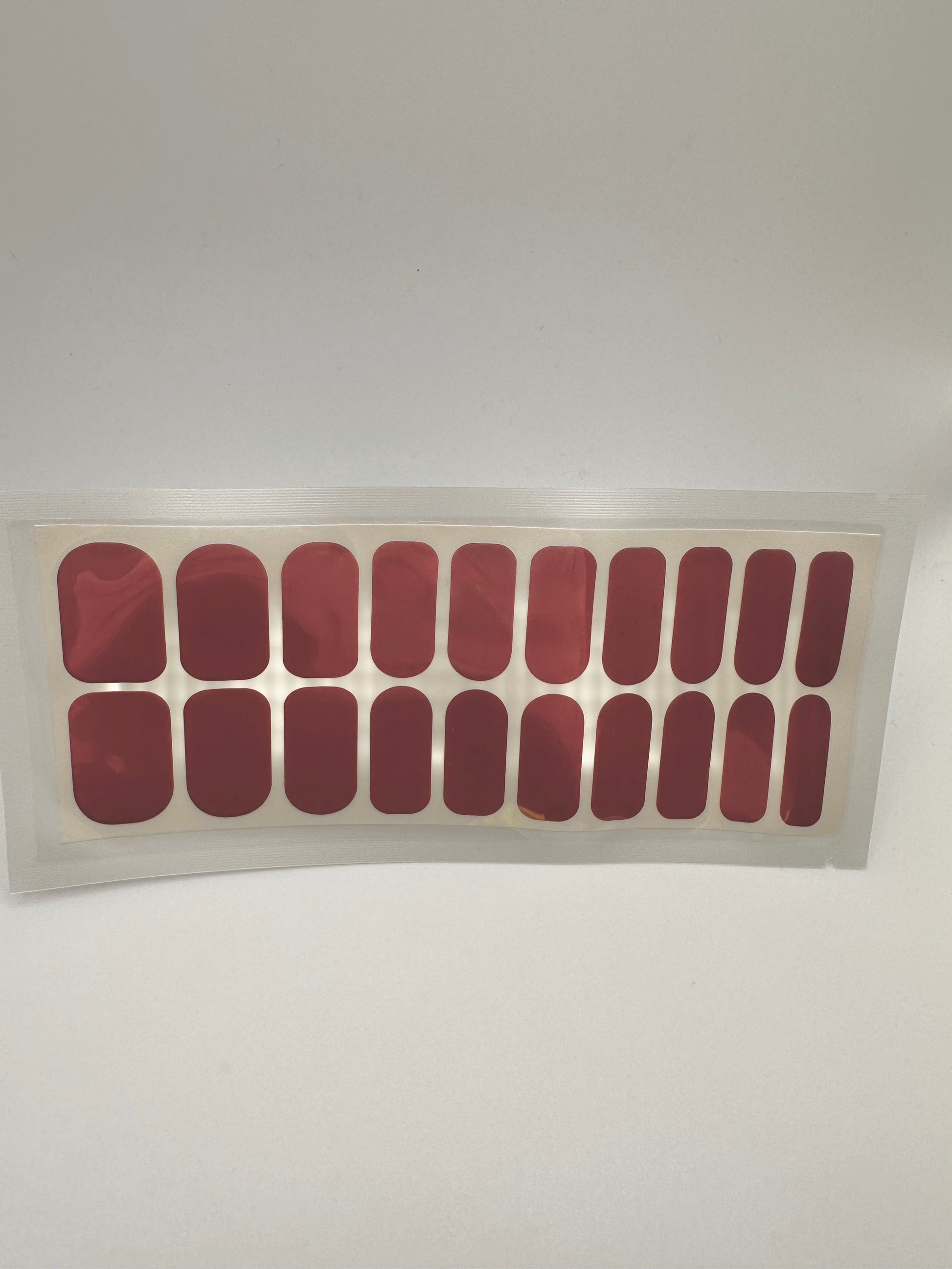 Deep burgundy solid colour gel nail wraps in wide fit set of 20 pieces for at-home manicure