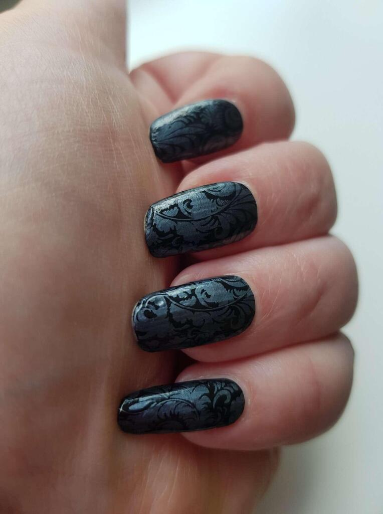 Black non-UV nail wraps with ornate blue gothic pattern on natural nails