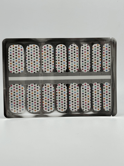 Full set white polka dot nail wraps in packaging showing classic manicure design strips