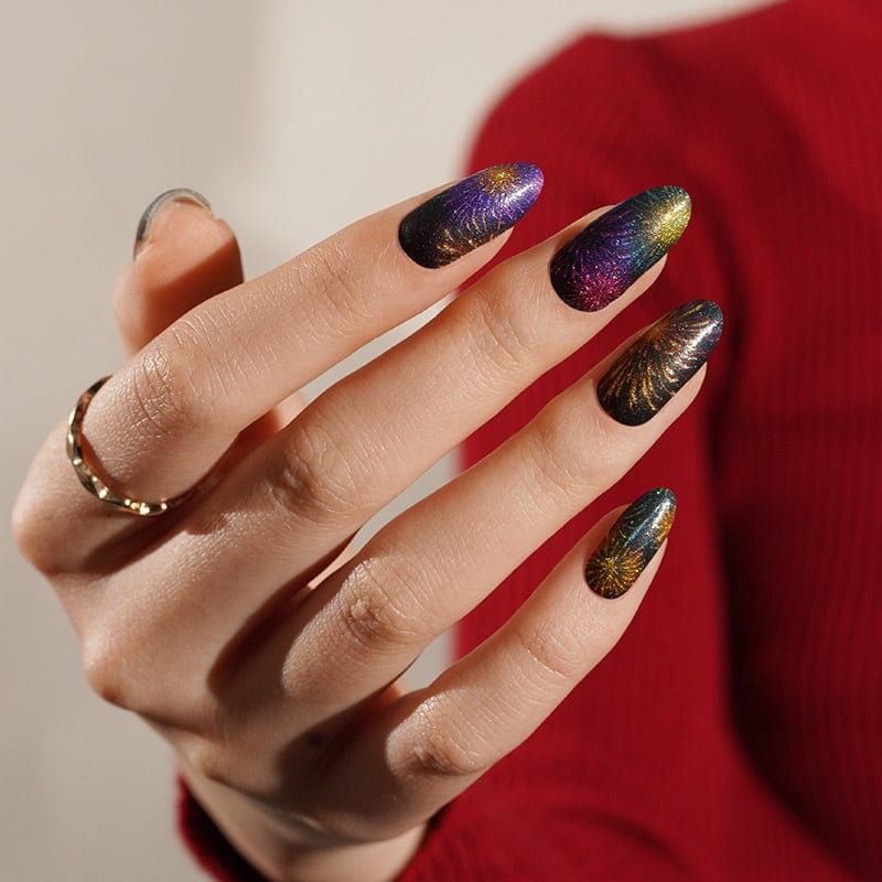 Colourful firework design nail wraps on hand with purple and gold glitter finish