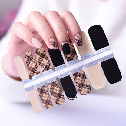 Boucle patterned nail wraps in nude and black on hand with tweed texture design