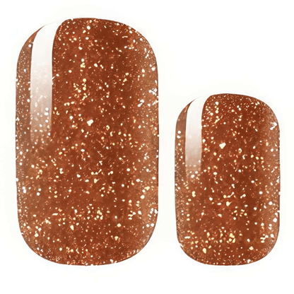 Close-up burnt sienna glitter nail wraps showing sparkly orange-brown texture detail