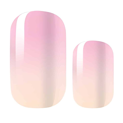 Individual pink ombre nail wraps showing gradient effect from pink to cream