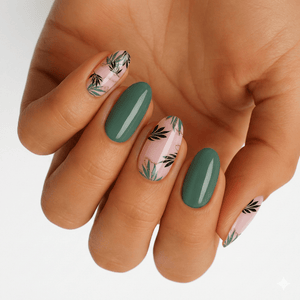Green and pink nail wraps with botanical fern leaf pattern on hand manicure